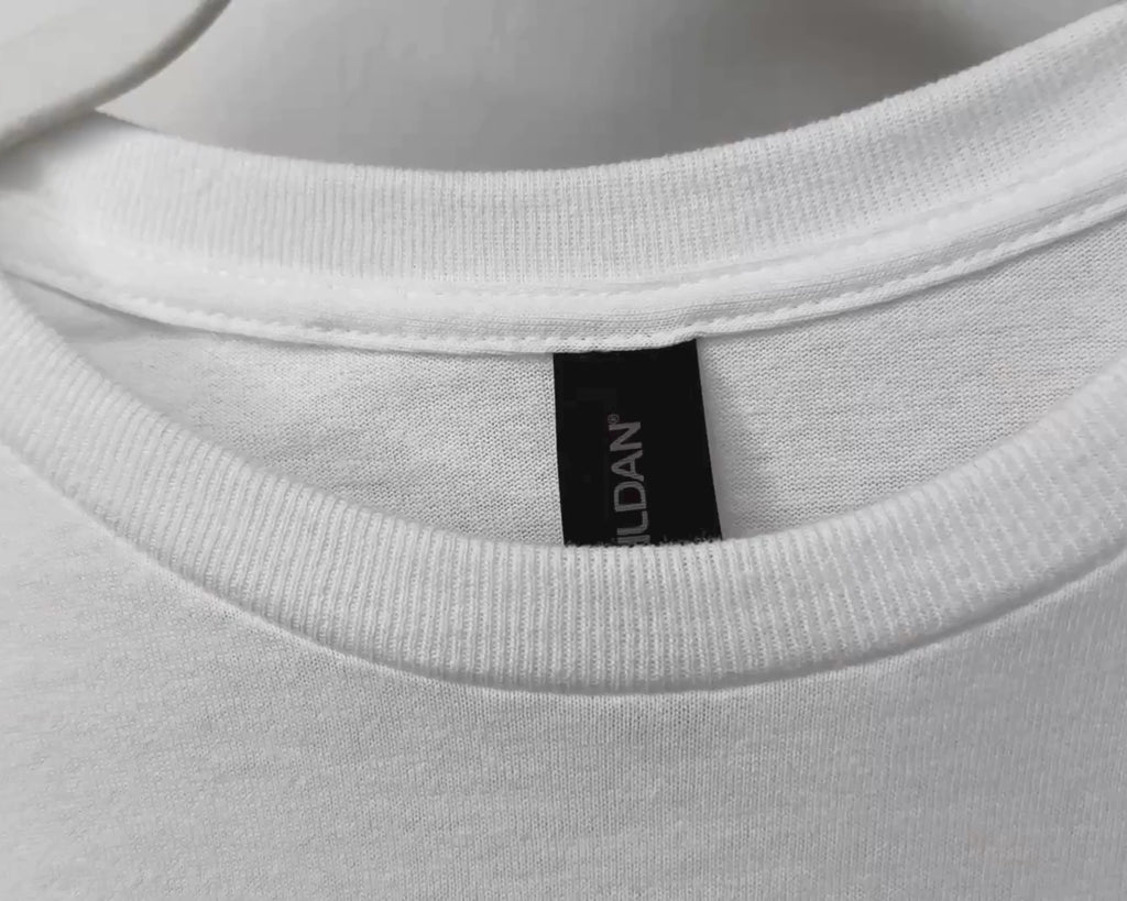 Close-up view of Gildan 64000 Softstyle T-shirt fabric, stitching, and garment details